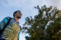 Man Wearing Tie Dye Sweater Looking hopeful Royalty Free Stock Photo