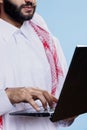 Muslim man typing on laptop closeup Royalty Free Stock Photo