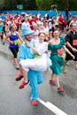 Man Wearing Tux Carries Fiancee Across 10K Race Finish Line Royalty Free Stock Photo