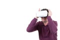 Man wearing using virtual reality VR glasses helmet headset on white background. Smartphone using with virtual reality goggles. Royalty Free Stock Photo
