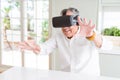 Man wearing virtual reality glasses smiling looking very happy and excited Royalty Free Stock Photo