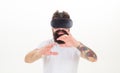 Man wearing virtual reality goggles. Bearded man wearing virtual reality goggles in studio. Virtual reality experience. Royalty Free Stock Photo