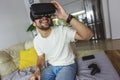 Man wearing virtual reality goggles at home Royalty Free Stock Photo