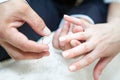 Man wearing wedding ring on bride finger Royalty Free Stock Photo