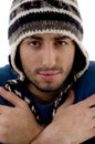 Man wearing winter cap shivering from cold Royalty Free Stock Photo
