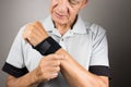 Man wearing a wrist brace or wrap on his left hand and wrist Royalty Free Stock Photo