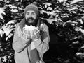 Man wears knitted hat, scarf, gloves. Guy with happy face Royalty Free Stock Photo