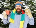 Man wears knitted hat, scarf and gloves with happy face. Royalty Free Stock Photo