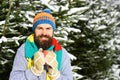 Man wears knitted hat, scarf and gloves with happy face. Royalty Free Stock Photo