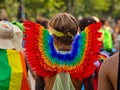 A man wears rainbow angel wings on Christopher Street Day CSD