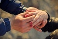 Man wears a wedding ring on woman's hand Royalty Free Stock Photo