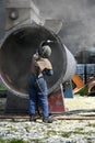 Engineer sandblasting a steel casing Royalty Free Stock Photo