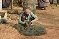 man weaving fishing net at henry island, WestBengal, india Royalty Free Stock Photo