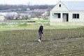 A man is weeding a garden in the garden. Spring cares in the garden.