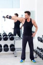 Man with weight training equipment on sport gym Royalty Free Stock Photo