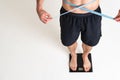 Man with weights health pondered, health and sports on a white background back painful, cramp young stress, muscular Royalty Free Stock Photo