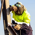 Man welding metal on a construction site Royalty Free Stock Photo