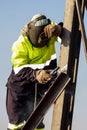 Man welding metal on a construction site, Tradesman working with Royalty Free Stock Photo
