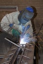 Man welding on production line