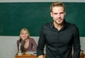 Man well groomed attractive teacher in front of classroom. Obsessed with knowledge. Teacher of her dreams. Handsome Royalty Free Stock Photo