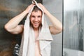Man with wet hair hold towel after shower. Morning washing, wake up, everyday life. Refreshment, healthcare. Hygiene Royalty Free Stock Photo