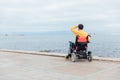 a man with disabilities in a wheelchair enjoys life Royalty Free Stock Photo