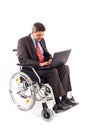 Man in a wheelchair with laptop Royalty Free Stock Photo