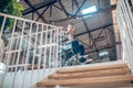 Man in wheelchair looking down stairs in horror Royalty Free Stock Photo