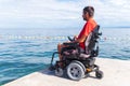 Man on electric wheelchair Royalty Free Stock Photo