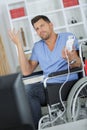 Man in wheelchair making nonchalant gesture Royalty Free Stock Photo