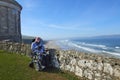 Man in a wheelchair at Mussenden Temple benone beach Co Derry Londonderry Northern Ireland Royalty Free Stock Photo