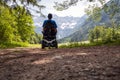 Man on a wheelchair in nature Royalty Free Stock Photo