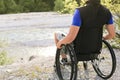 Man in wheelchair outside in nature