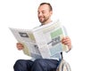 Man in wheelchair reading newspaper Royalty Free Stock Photo