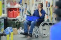 man in wheelchair shopping in hardware store