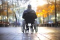 Man in Wheelchair Sitting on Sidewalk Royalty Free Stock Photo