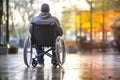 Man in Wheelchair Sitting on Sidewalk Royalty Free Stock Photo