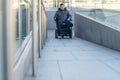 Man in a electric wheelchair using a ramp Royalty Free Stock Photo