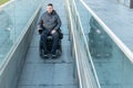 Man in a electric wheelchair using a ramp Royalty Free Stock Photo