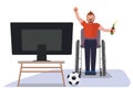 Man in wheelchair watch soccer on TV