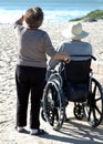 Man in wheelcheair at the beach Royalty Free Stock Photo