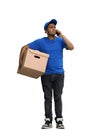 A man on a white background with box conversate on the phone Royalty Free Stock Photo