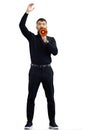 A man, on a white background, in full height, with a megaphone Royalty Free Stock Photo