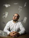 Man in white and dollars Royalty Free Stock Photo