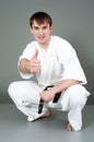 Man in white karate suit Royalty Free Stock Photo