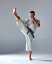 Man in white kimono training karate Royalty Free Stock Photo