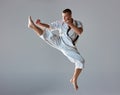 Man in white kimono training karate Royalty Free Stock Photo