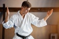 Karate Fighter practises fight in martial arts gym Royalty Free Stock Photo