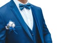 A man in a white shirt, blue suit with a butterfly and a boutonniere on white background, isolated, close-up Royalty Free Stock Photo