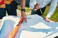 Two people examining house layout together outdoor Royalty Free Stock Photo